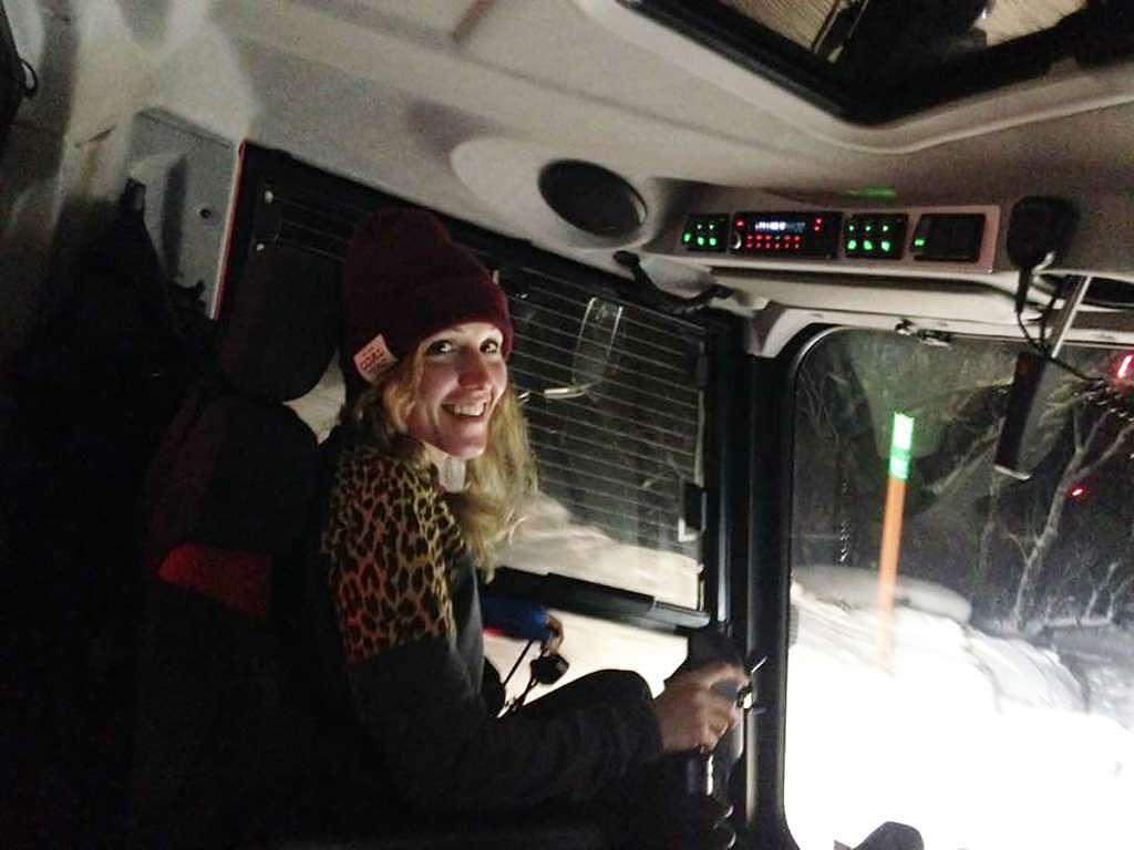 Photo of Karen Gilliot driving snowcat