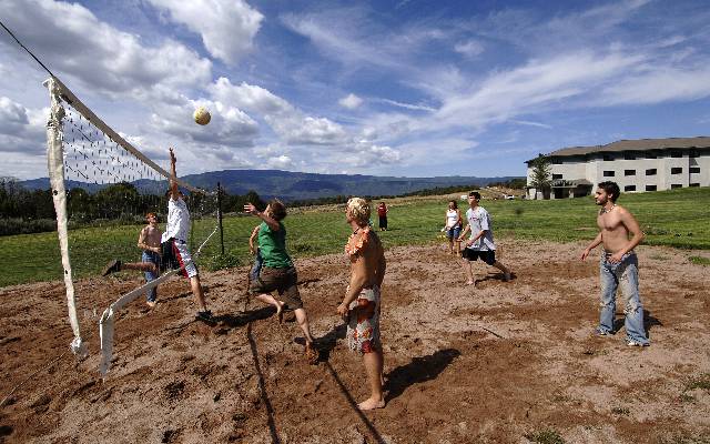 photo: students play volleyball on the Spring Valley Campus