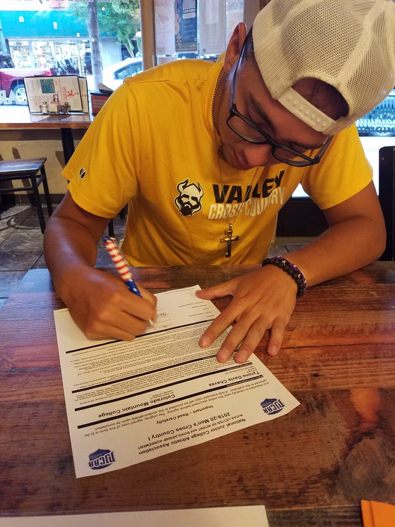 Tyrone Chavez, a 2019 graduate of Valley High School in Gilcrest, Colorado, signs to join CMC's cross-country running team.