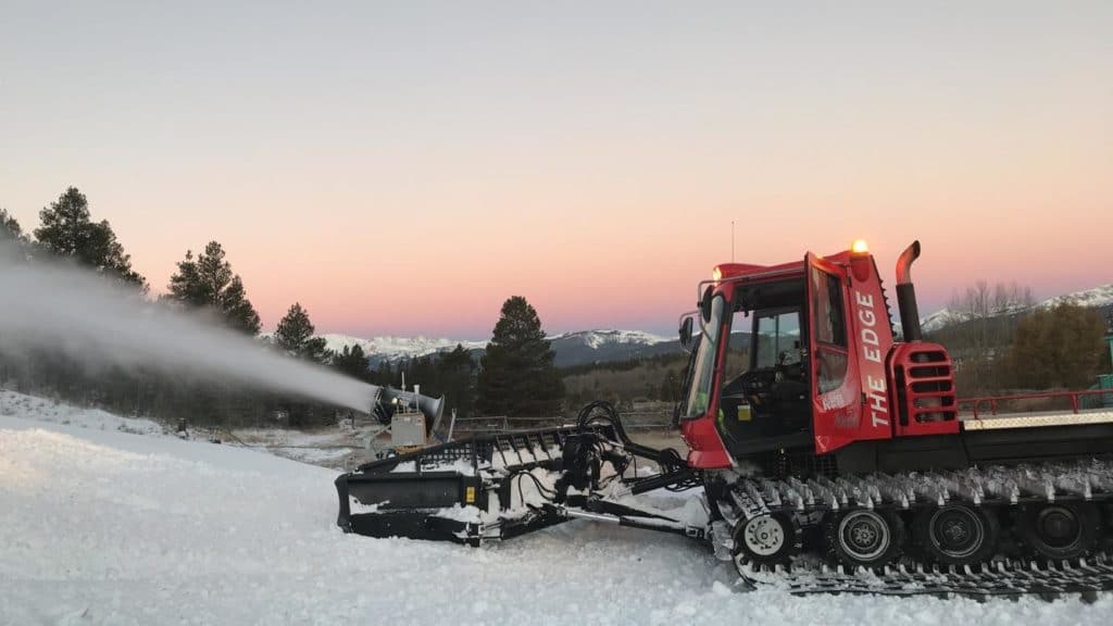Colin Whitaker, Ski Area Ops graduate at COlorado Mountain College Leadville, operating a snowcat during a Colorado sunset. He landed a full-time job at Killington Resort this past spring.