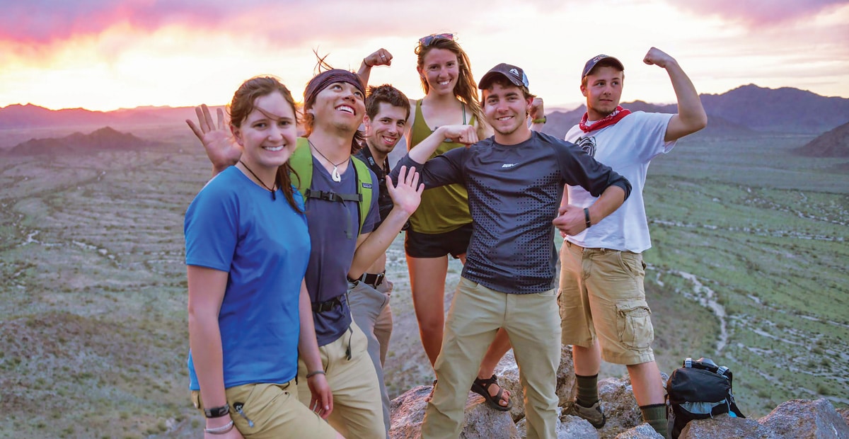 A group of Outdoor Education students at a scenic at dusk on a orientation trip.