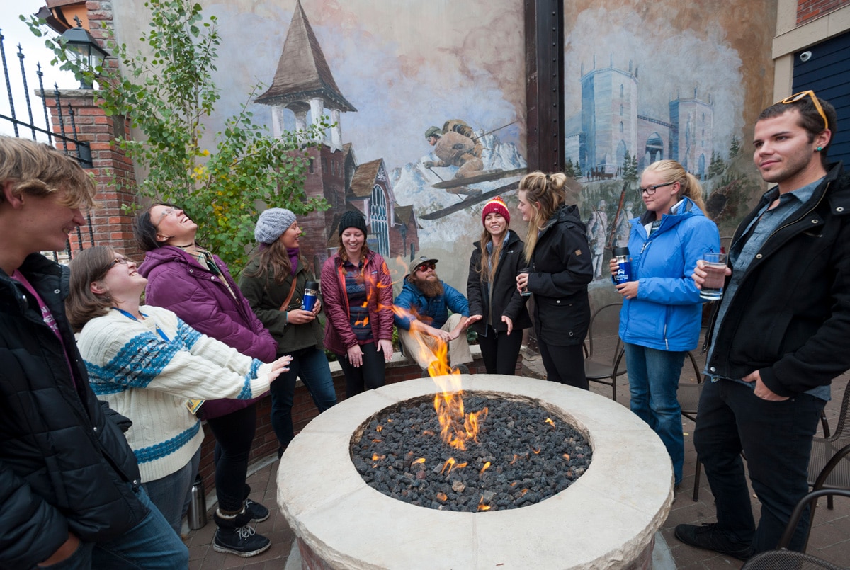 CMC students around a fire pit in downtown Leadville.