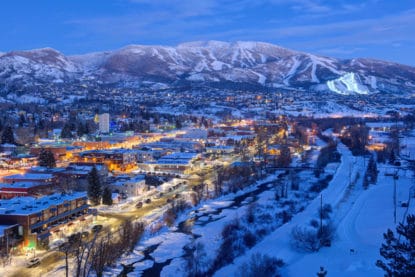 View overlooking downtown Steamboat Springs at dusk with the Steamboat Ski Area in the background