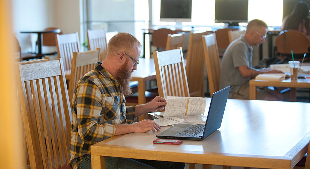 A student studies in the library at CMC Steamboat Springs
