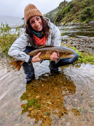 CMC Leadville Professional fly fishing guide scholarship recipient Heather Richie poses with a salmon on the last day of the Atlantic salmon season at Delphi Fly Fishing Lodge, Ireland.