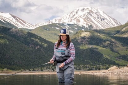Colorado Mountain College Leadville Professional Fly Fishing Guide student Heather Richie was the recipient of the 2021 Colorado Women Flyfishers Karen Williams Memorial Scholarship. Heather poses by high alpine lake in her fly fishing gear.