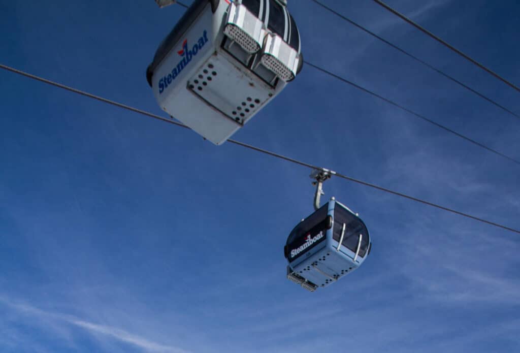 looking up at two gondolas at the Steamboat Springs ski area
