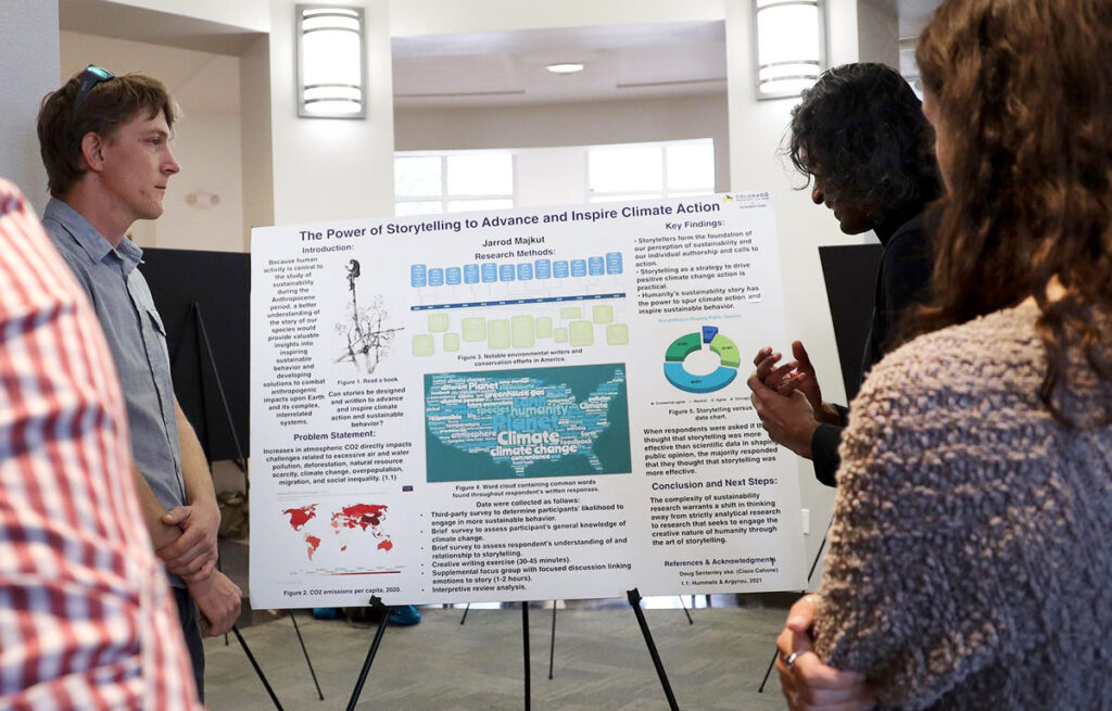CMc sustainabilty program students show their posterboard projects.