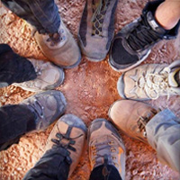 circle of boots and hiking shoes